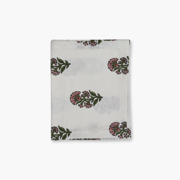 Linen hand-printed runner with scattered floral motifs on a light background
