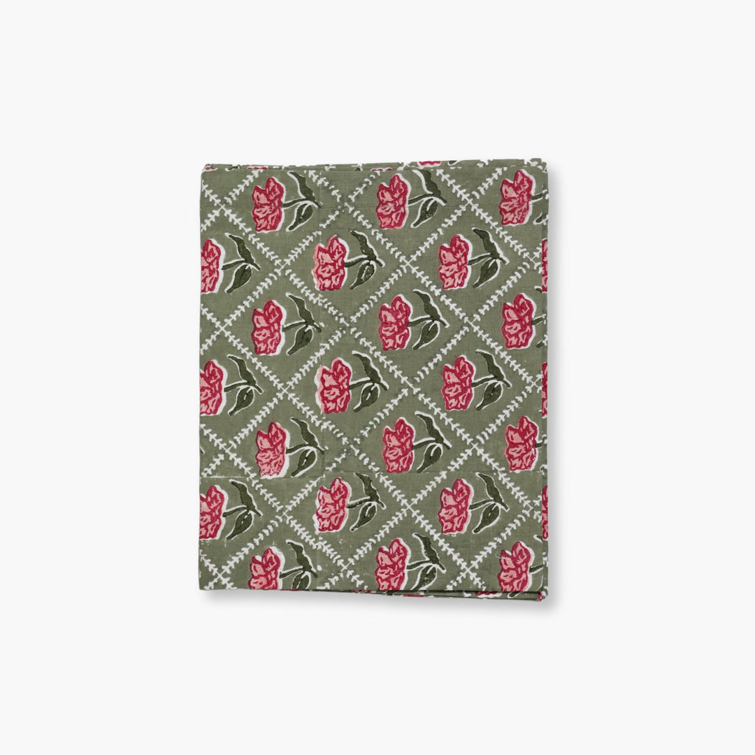 Olive linen table runner with pink-red handprinted floral pattern
