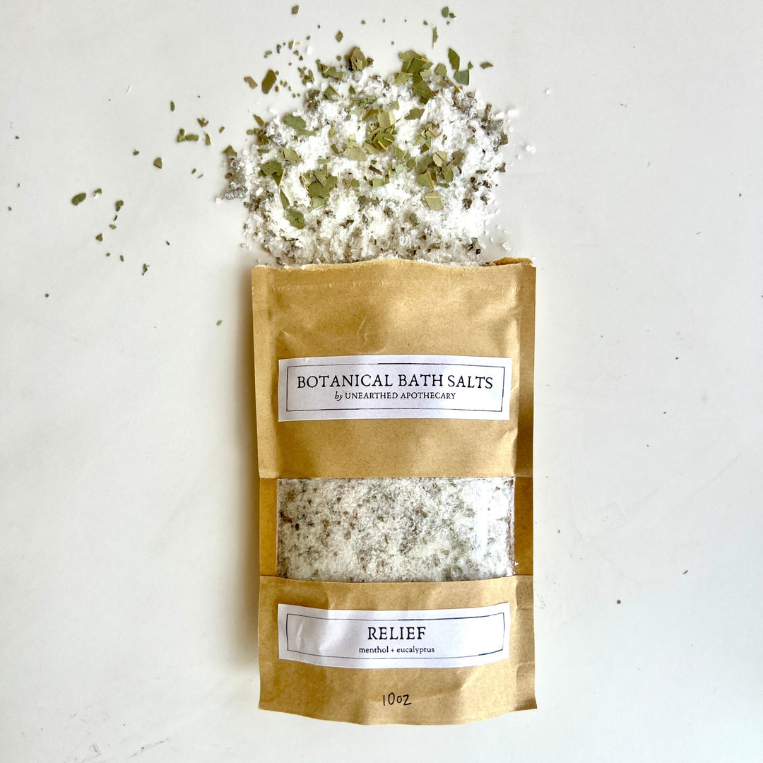 Botanical bath salts pouch with white salt granules, RELIEF label on kraft bag