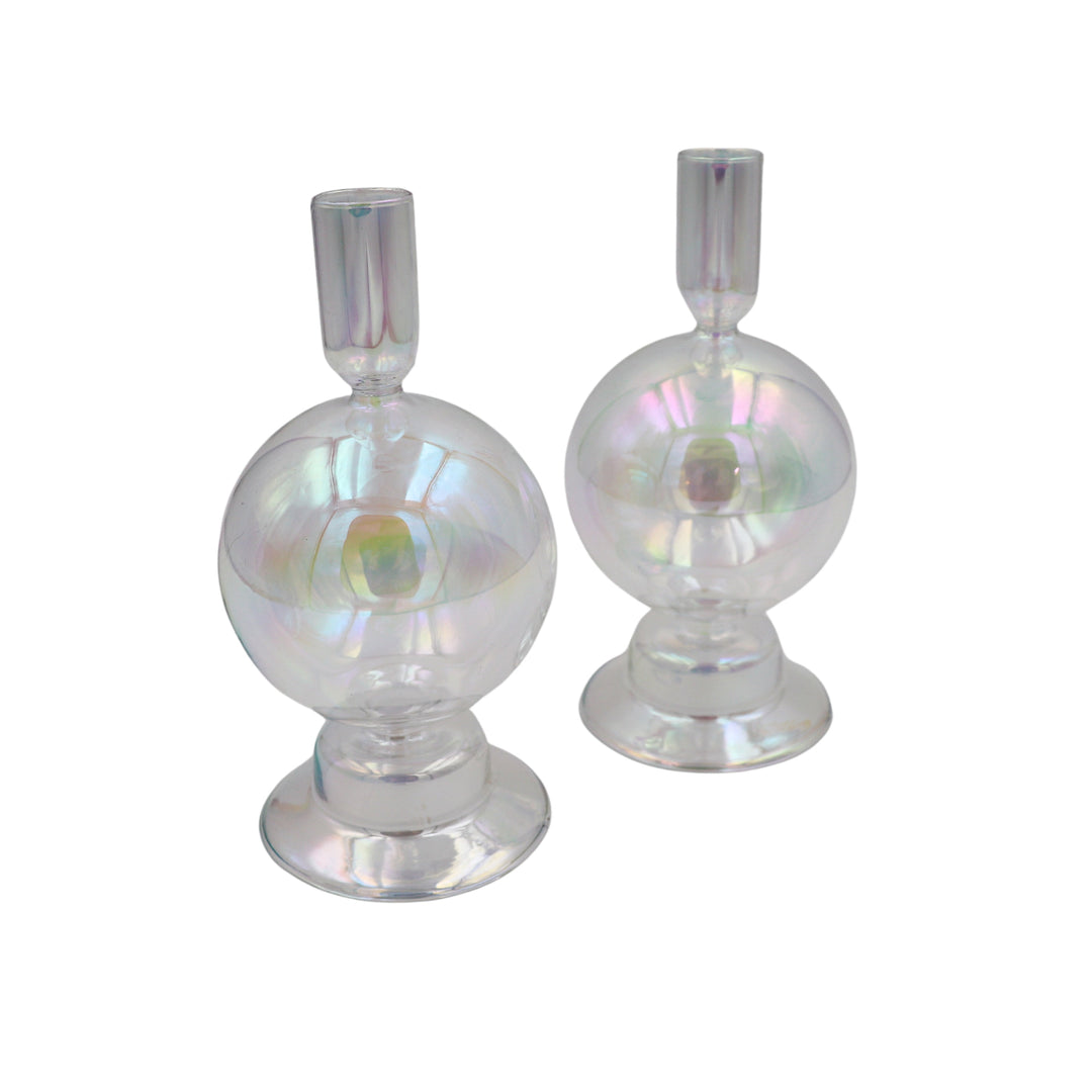 Two iridescent glass candle holders with round bauble bowls and cylindrical tops