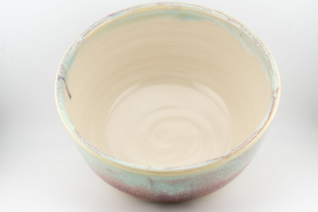 Ceramic large bowl interior with cream base and pale blue-green speckles