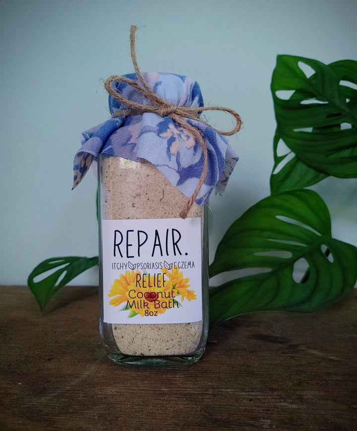 Coconut milk body soak in glass jar labeled Repair &amp; Relief Milk Bath, 8 oz