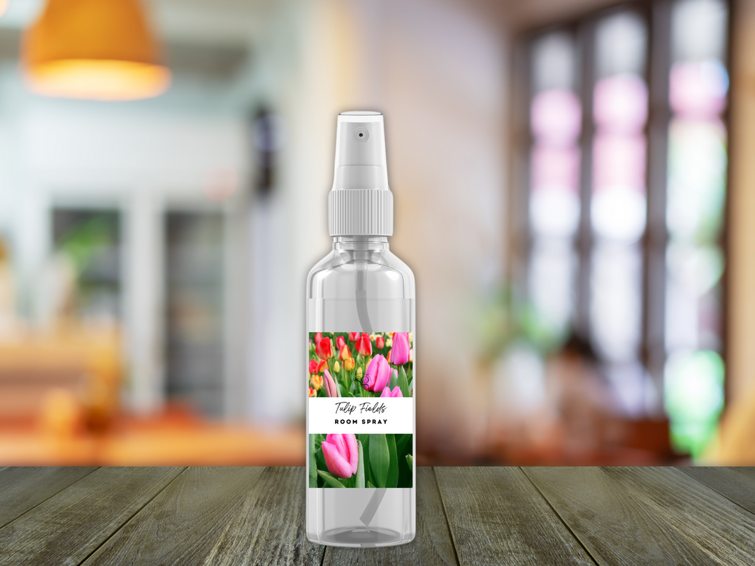Single room spray bottle with white pump on a wooden table with blurred background