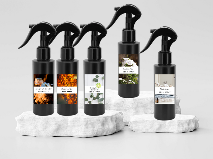 Room spray bottle set with black trigger sprayers on white fabric cubes