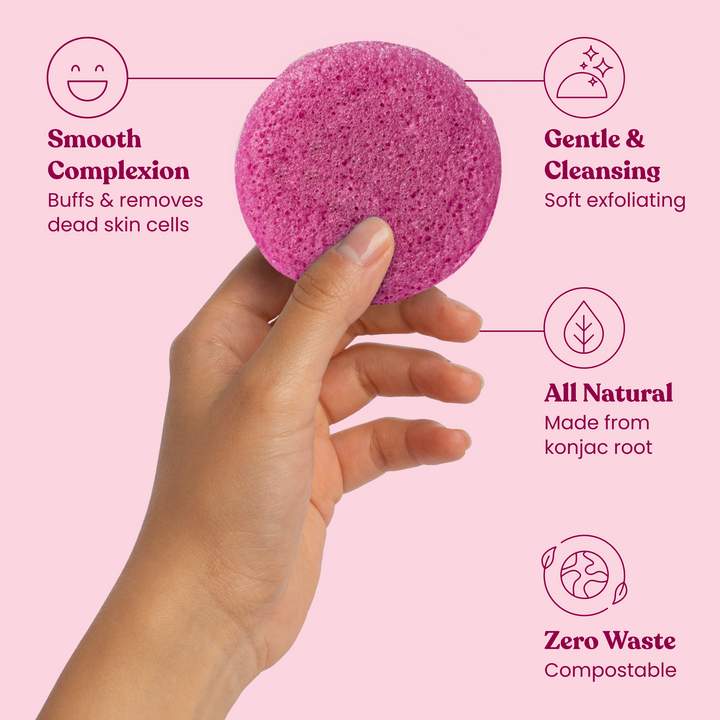 Pink konjac facial cleansing sponge held in hand for gentle exfoliating