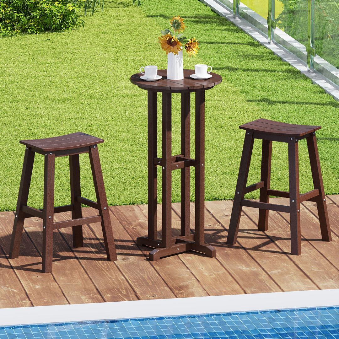 Outdoor dark brown bar table with matching stools on a wooden deck