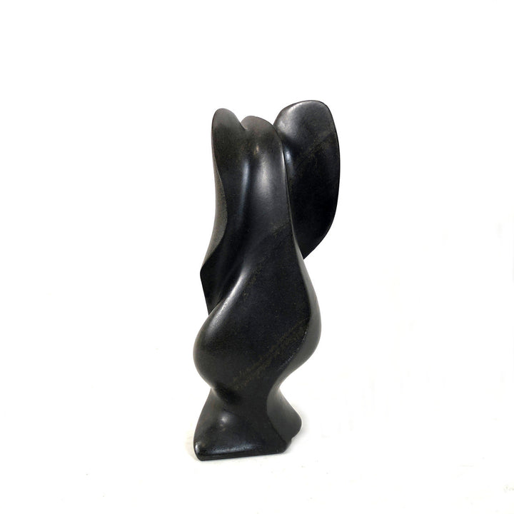 Dark gray-black stone elephant figurine, carved side view with curved trunk