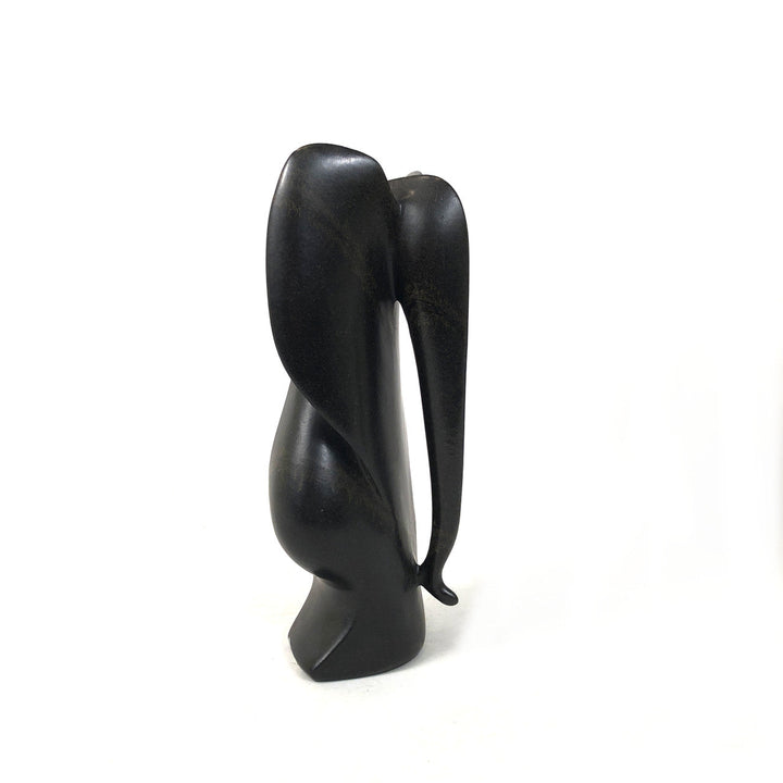 Dark gray-black stone elephant figurine, carved front view with open trunk area