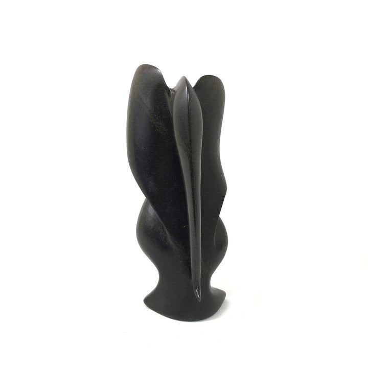 Dark gray-black stone elephant figurine, polished carved form with raised ears