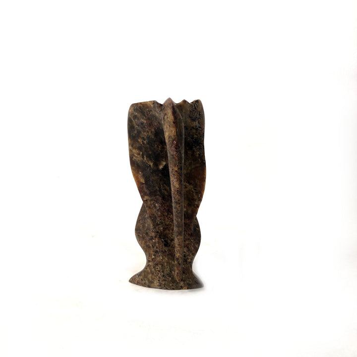 Speckled brown stone elephant figurine, carved upright with trunk detail