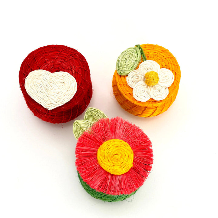 Set of woven mini baskets: green with red flower, plus red and yellow baskets.