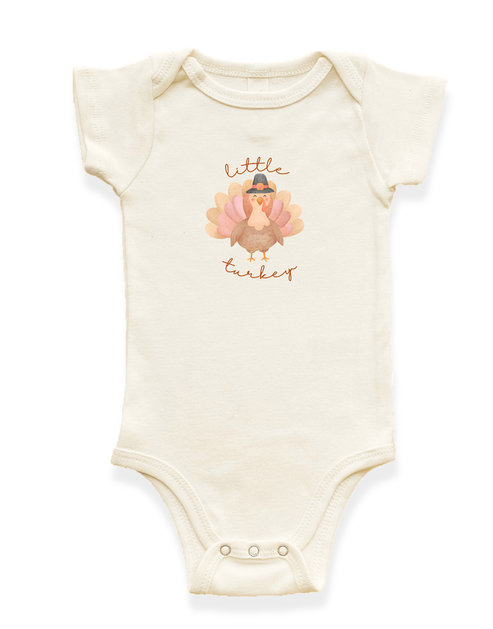 Organic baby bodysuit in light cream with short sleeves and Little Turkey graphic