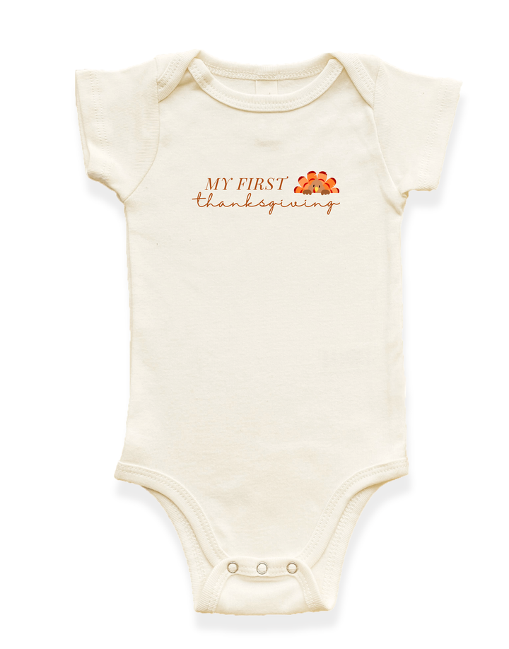 Organic baby bodysuit, short-sleeve cream with “My First Thanksgiving” graphic on chest