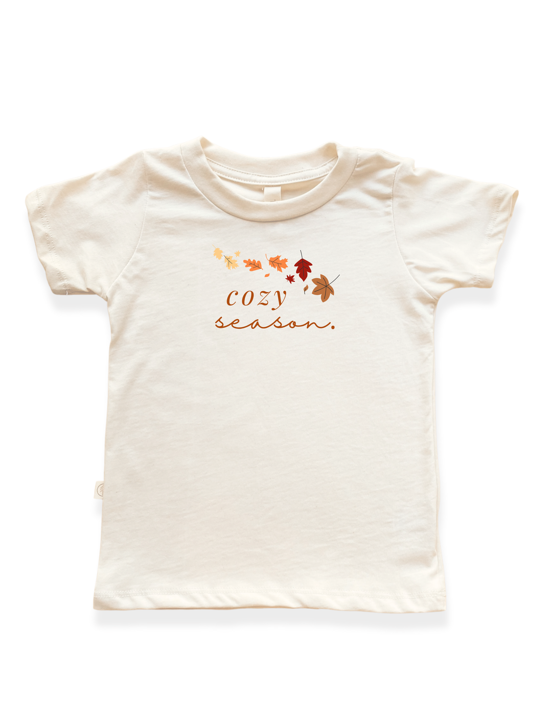 Kids organic T-shirt in cream with orange cozy season text and leaf graphic
