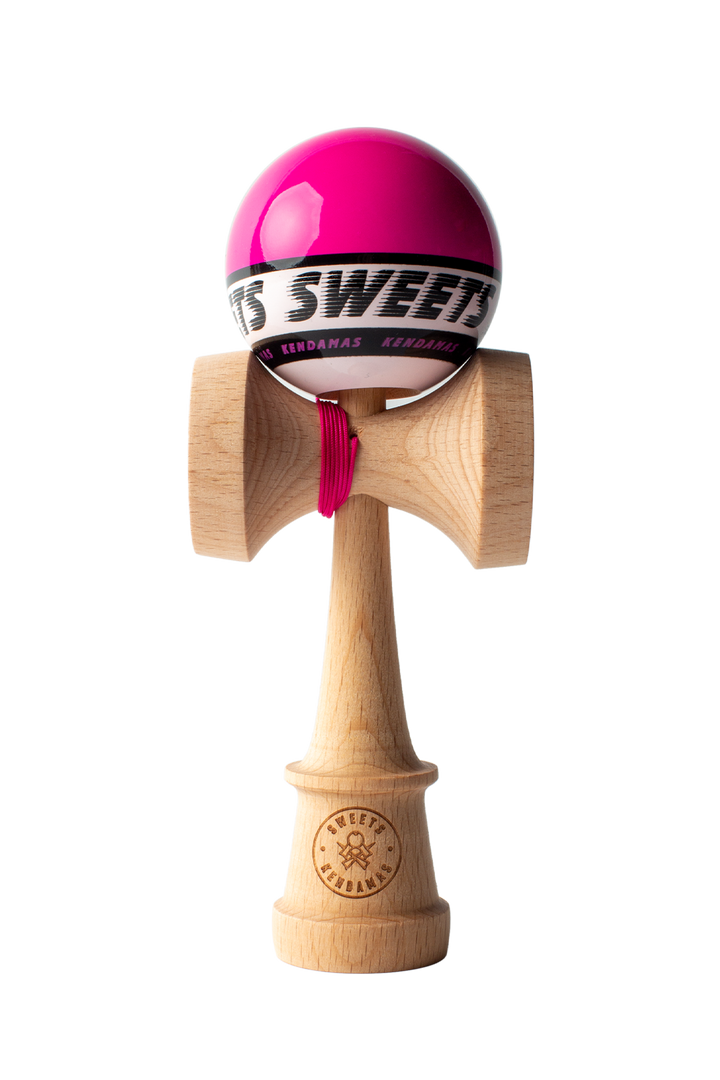 Wooden kendama toy with pink ball, black logo ring, and red string