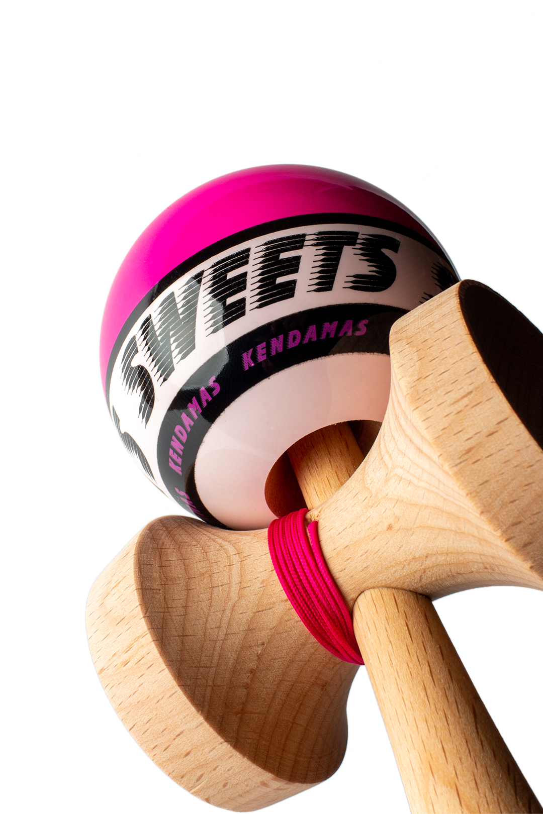 Wooden kendama with pink ball and black logo band, shown from side