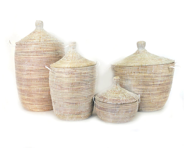 Set of white woven baskets with lids, includes small and tall pieces