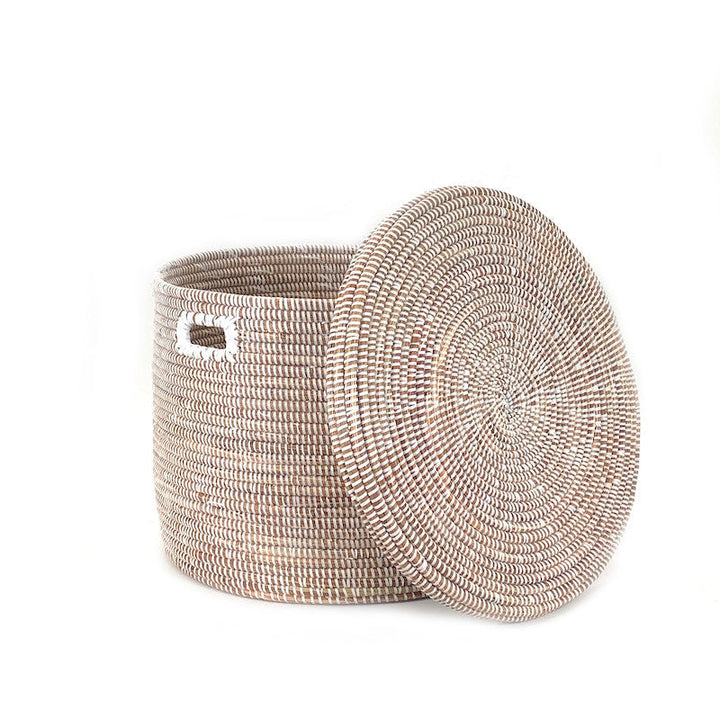 Round woven floor basket with attached flat lid, light neutral tone, side cutout