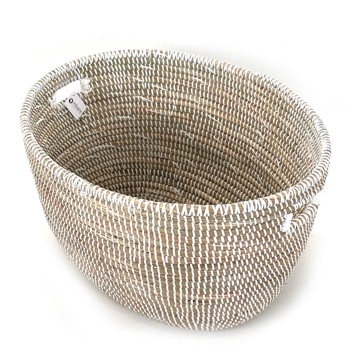 Woven oval basket with striped light-and-dark rope weave and curved handles
