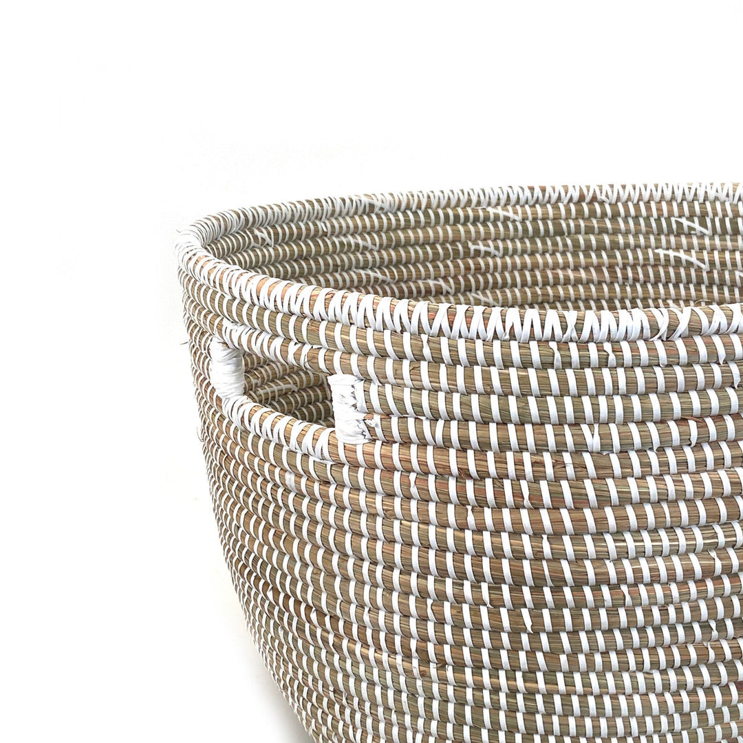 Close-up of woven oval basket rim with light-and-dark stripe rope weave