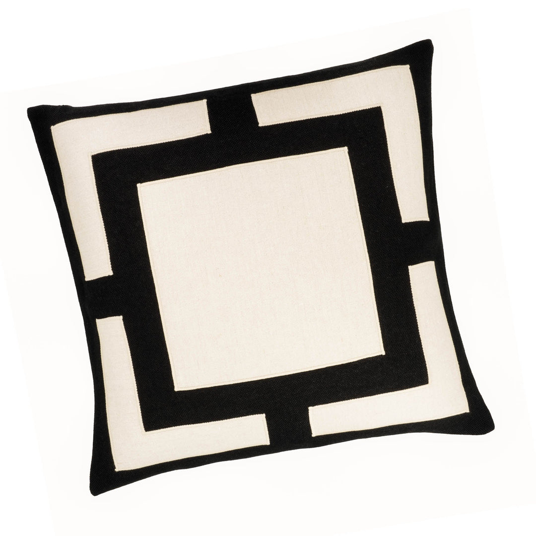 Black and white geometric throw pillow with layered square pattern, stitched edging