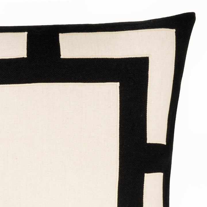 Black and white geometric throw pillow close-up of layered square and contrast blocks