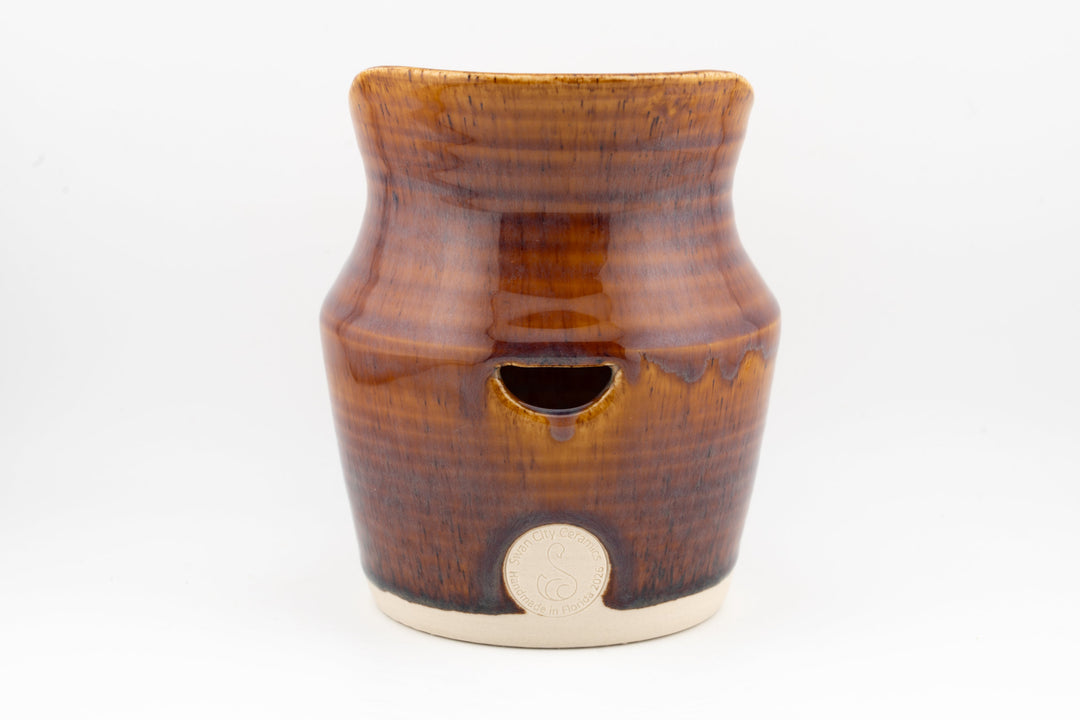 Ceramic dried flower sconce with side cutout, dark brown glaze with small medallion badge