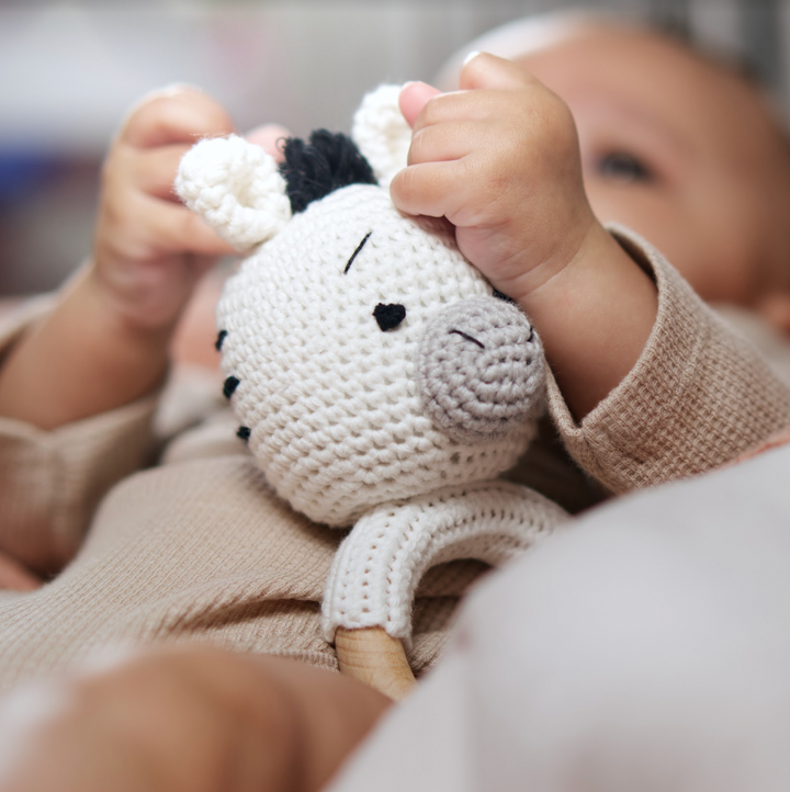 Organic cotton rattle ring teether with zebra head and wooden ring, textured crochet