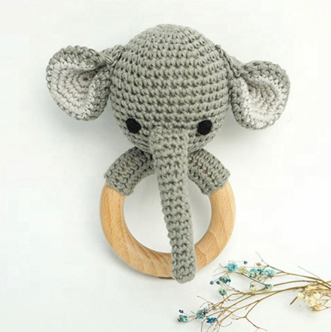 Grey crochet elephant rattle teether with black eyes and wooden ring, ears up