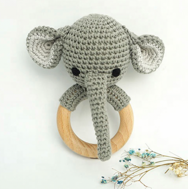 Grey crochet elephant rattle teether with black eyes and wooden ring, ears up