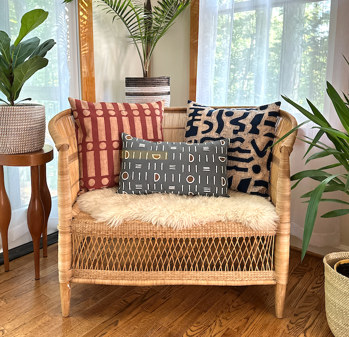 Lumbar pillow cover in dark gray with white graphic mudcloth lines and small brown accents