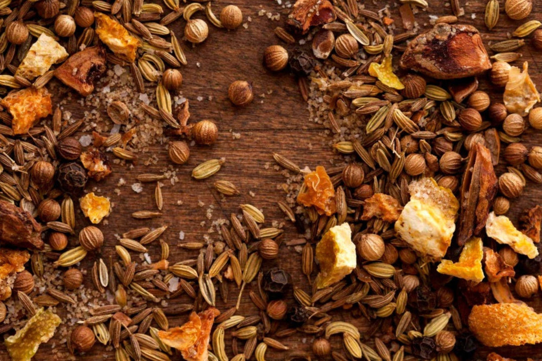 Dried spice mix with cumin-like seeds and orange herb chunks