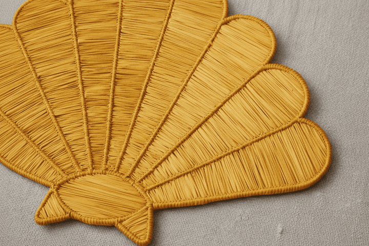 Handwoven iraca shell placemat, dark green stitched rays with curved scallop edges