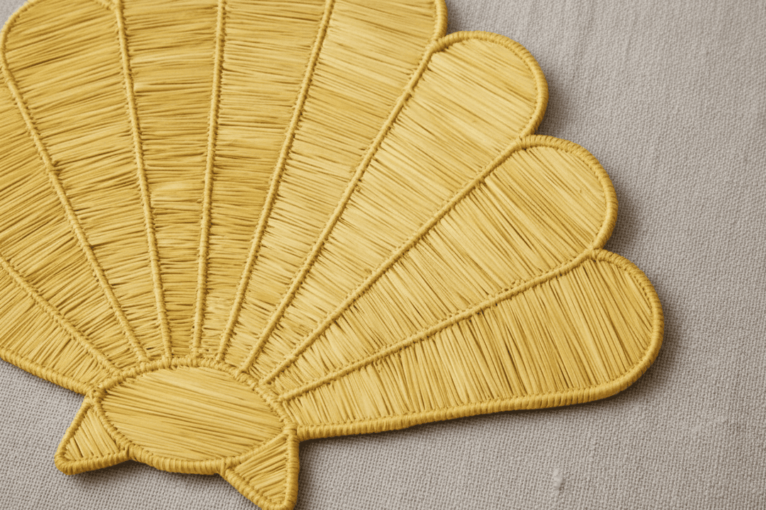 Handwoven shell placemat in sage green with ridged woven texture
