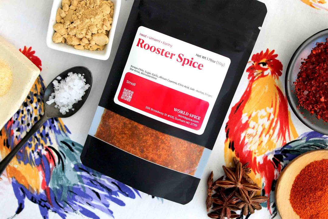 Rooster Spice pouch with red label and rooster illustration, surrounded by spices