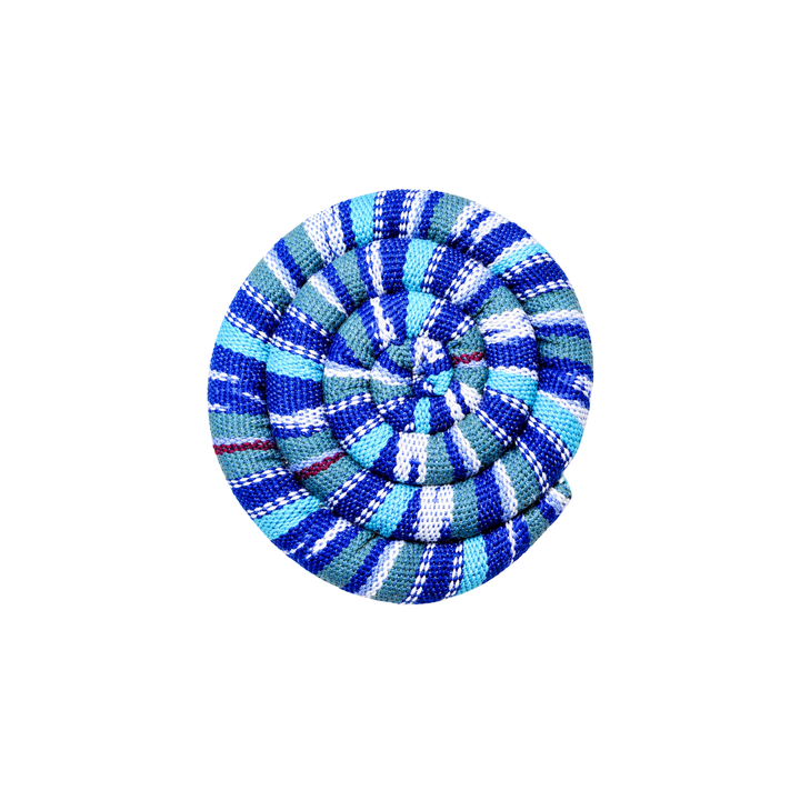 Round spiral trivet with blue and white plaid stripes and stitched rosette center