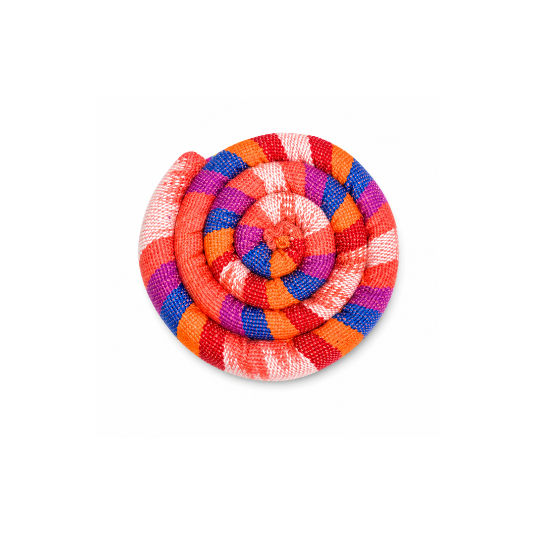 Round spiral trivet with red, blue, purple, and orange plaid stripes and stitched rosette center