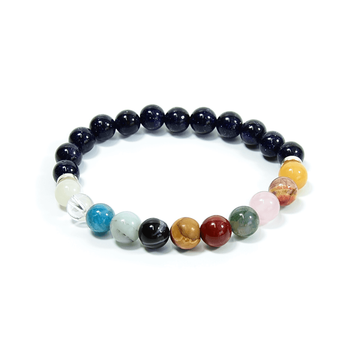 Beaded bracelet with dark blue round beads and mixed pastel, red, and gold accent beads