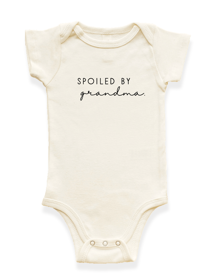 Cream short-sleeve baby bodysuit with snap crotch and "Spoiled by grandma" print
