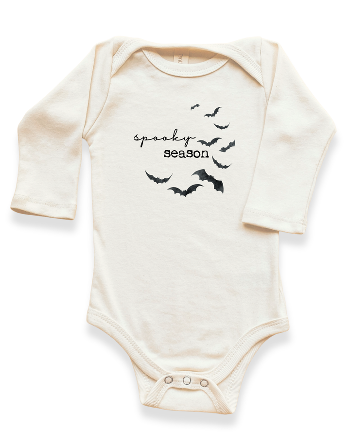 Light cream long-sleeve bodysuit with spooky bat graphics and snap crotch closure