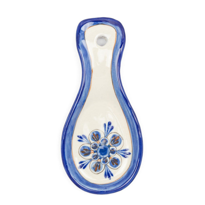 Blue-and-white ceramic spoon rest with floral base and hanging hole