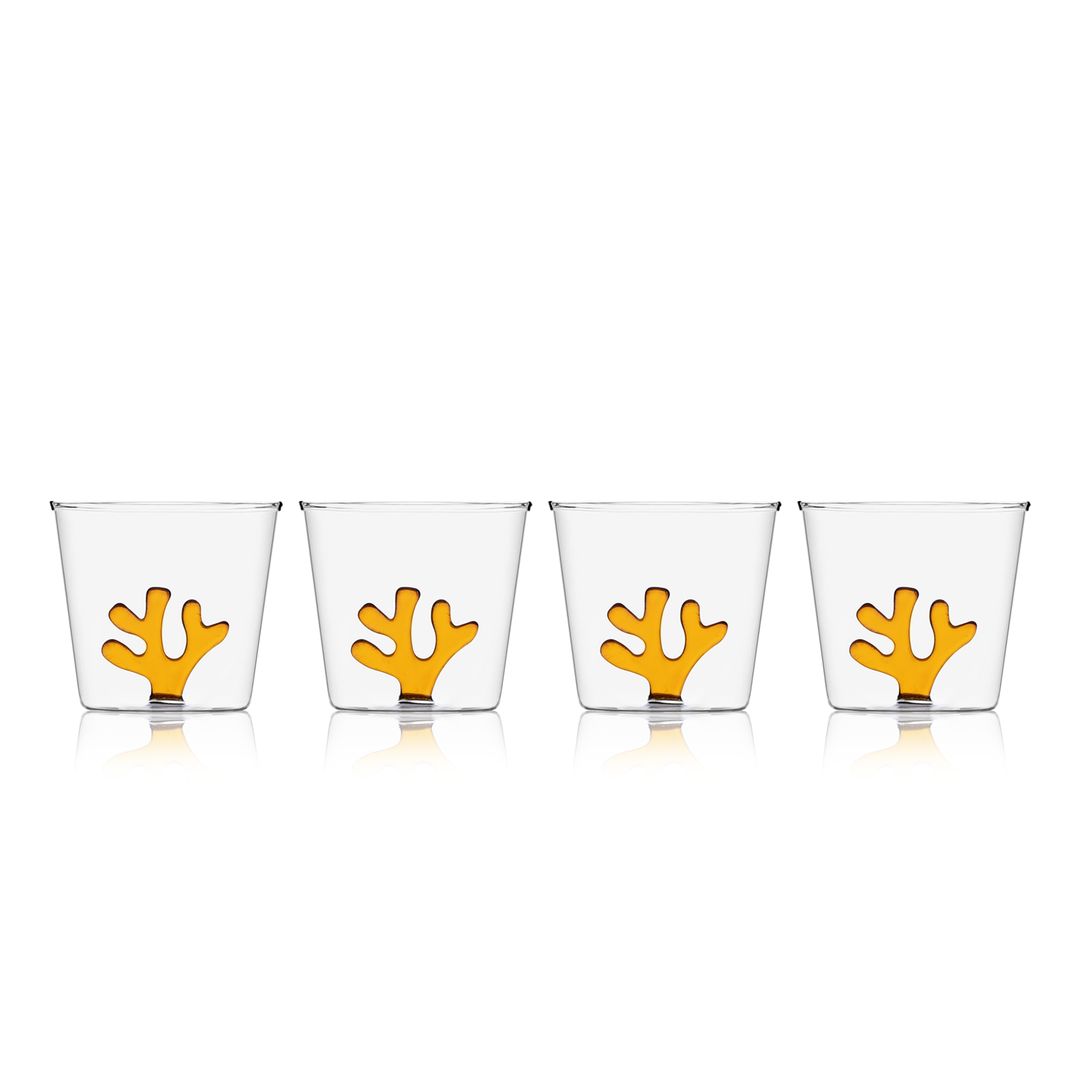 Set of four clear glass water tumblers with orange coral inserts