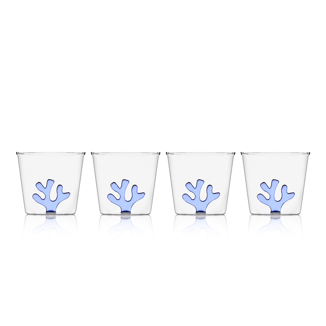 Set of four clear glass water tumblers with blue coral inserts