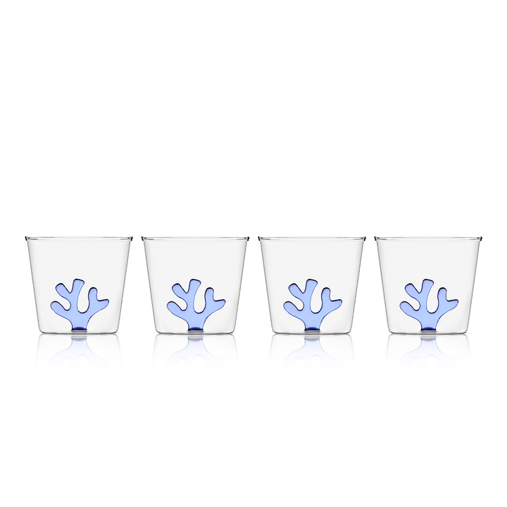 Set of four clear glass water tumblers with blue coral inserts