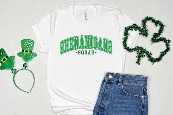Unisex graphic T-shirt, white with green “Shenanigans Squad” logo on front.