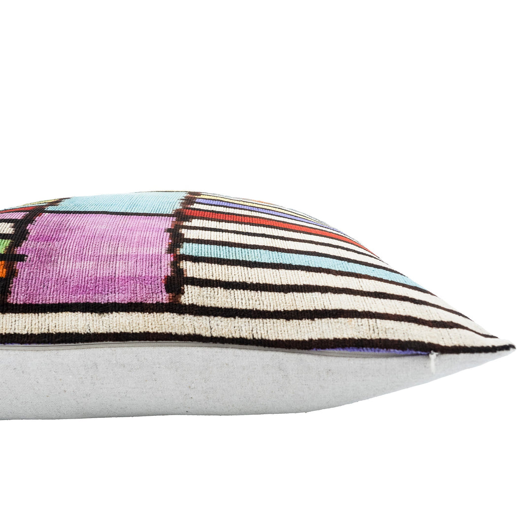 Silk velvet ikat pillow case close-up: multicolor striped front edge