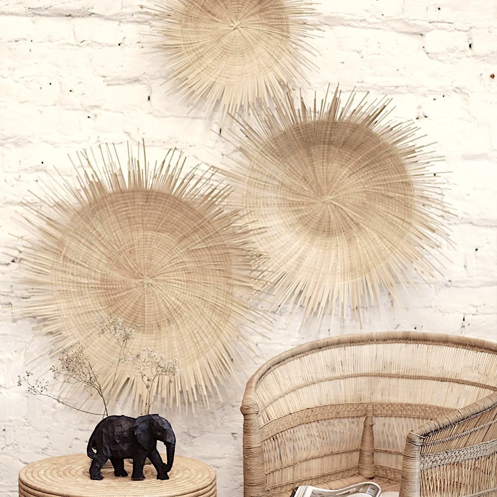 Set of woven raffia sunburst wall plates with three light tan round medallions