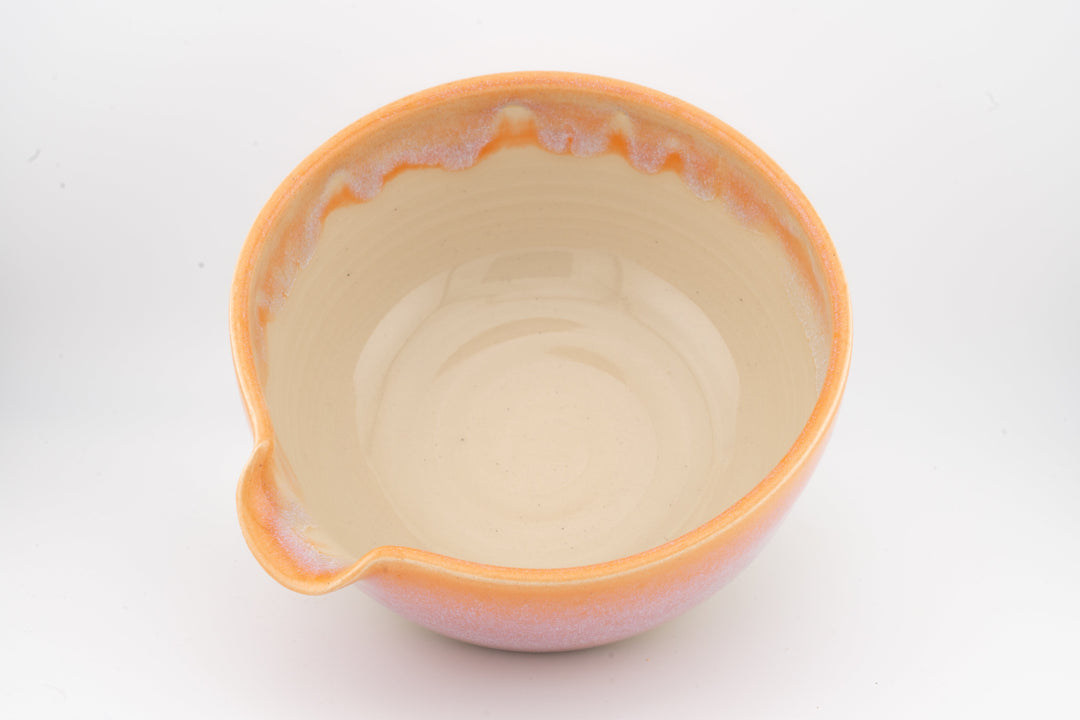 Ceramic bowl with optional spout, orange glaze with pale interior