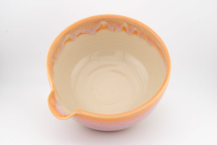 Ceramic bowl with optional spout, orange glaze with pale interior
