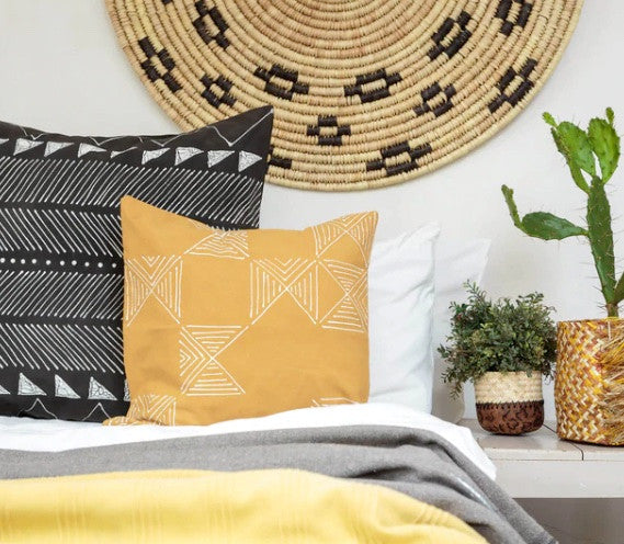 Mustard square pillow cover with white geometric lines, cornered diamond motifs